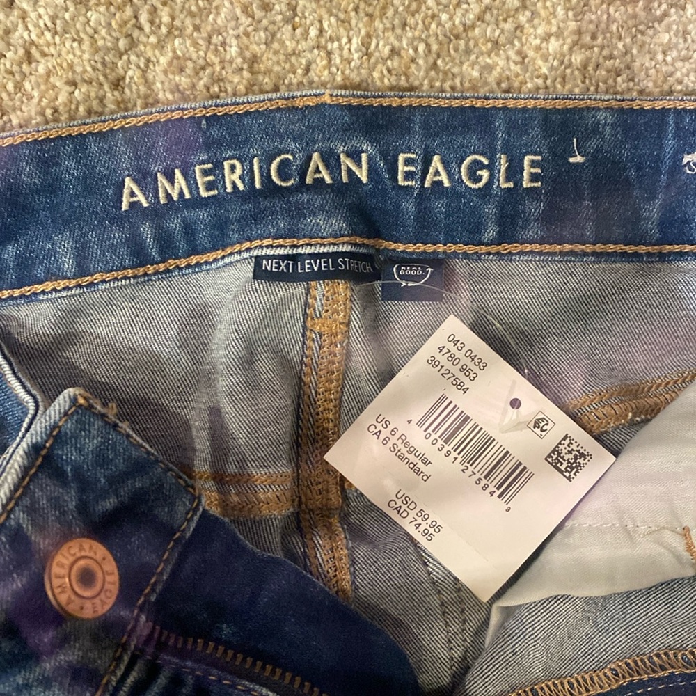 Ripped medium blue jeans